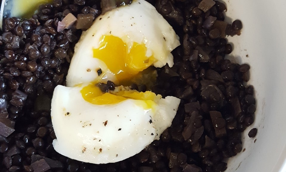 black lentil bowl with poached egg